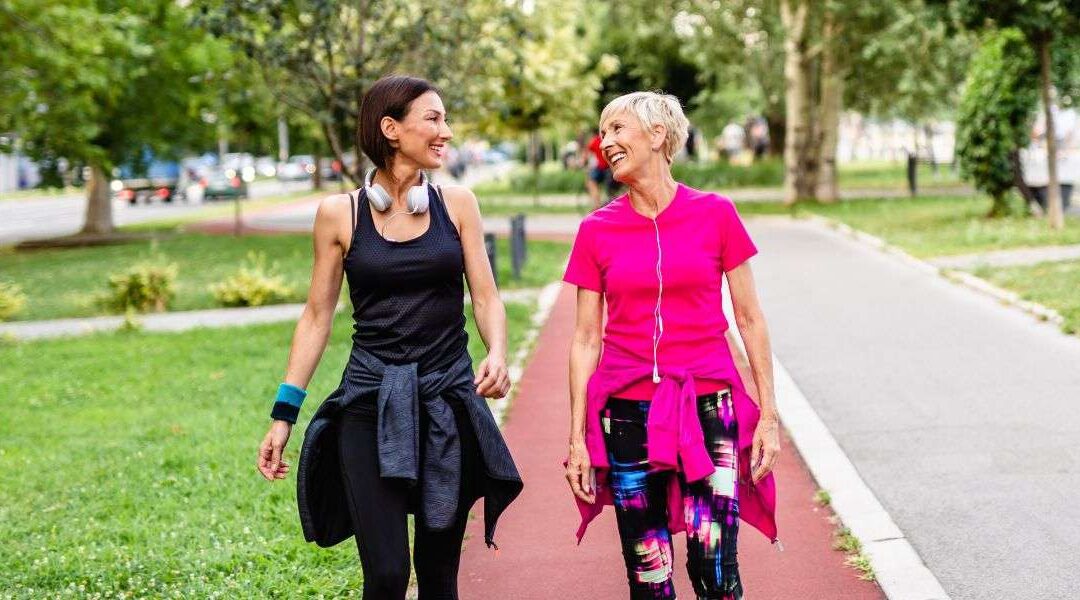Friends walking in the park to improve their physical health